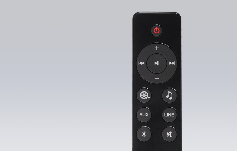 Black remote for speakers on gray background