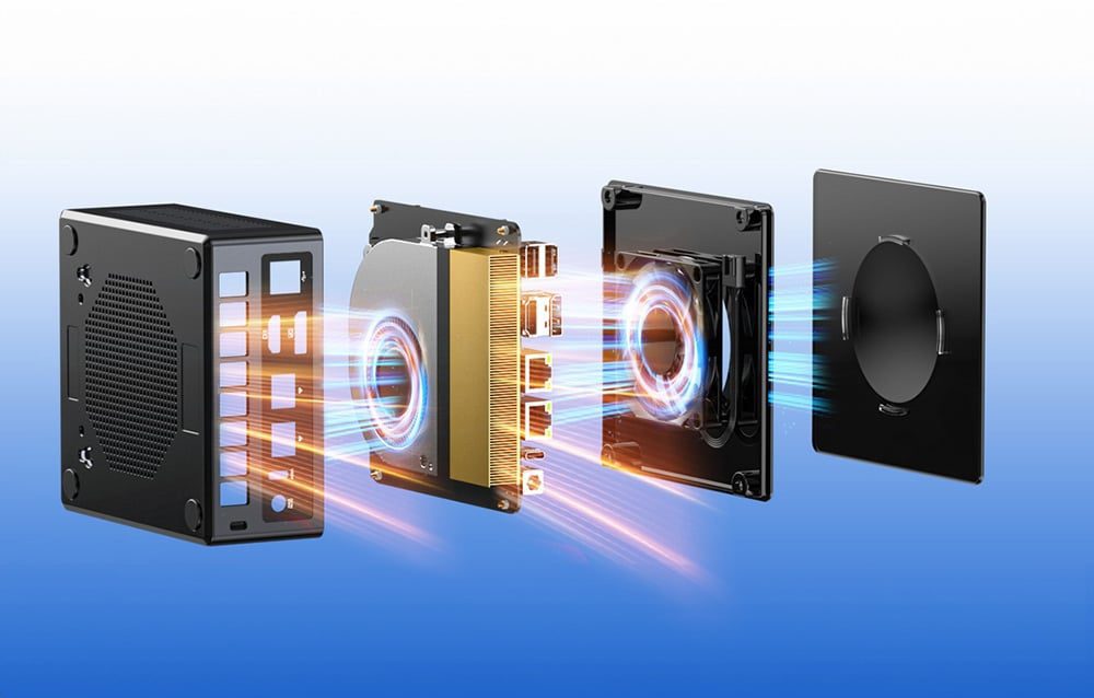 Unfolded mini PC shows internal components with cooling system and luminous components on blue background