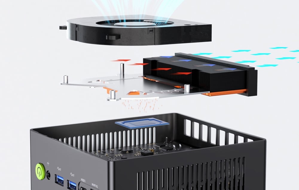 unfolded mini PC on gray background with cooling system shown